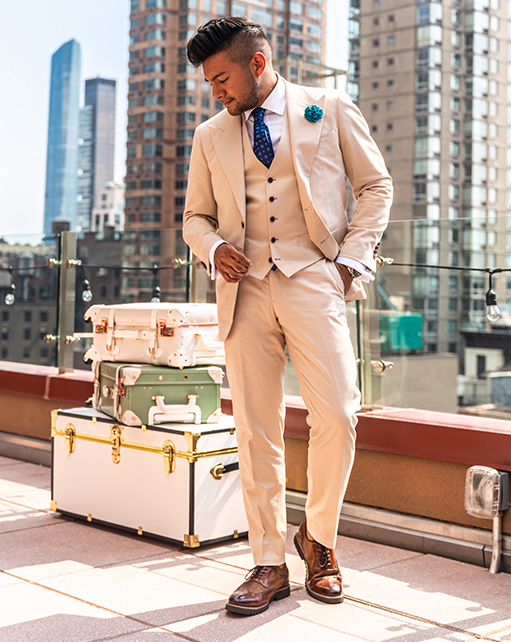 Image of social media influencer Diego Leon wearing the Baxley Wingtip Oxford in Cognac on a rooftop in Manhattan, NY.